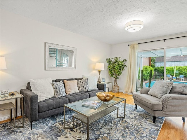 1234 N Pass Ave, Burbank, CA 91505 - living area featuring baseboards, a textured ceiling, and wood finished floors