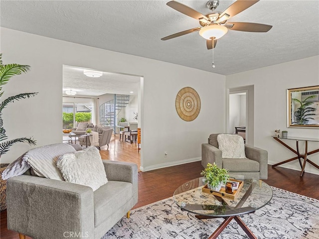 1234 N Pass Ave, Burbank, CA 91505 - living room featuring a textured ceiling, baseboards, ceiling fan, and wood finished floors