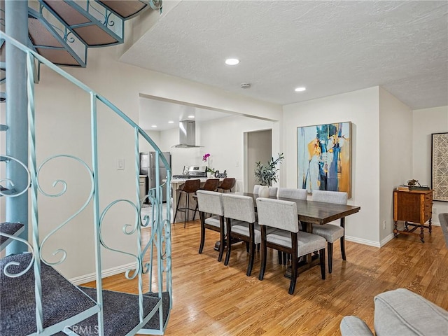 1234 N Pass Ave, Burbank, CA 91505 - dining room featuring baseboards, a textured ceiling, light wood finished floors, and stairs