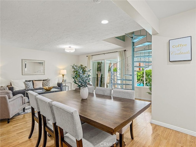 1234 N Pass Ave, Burbank, CA 91505 - dining area with light wood finished floors, a textured ceiling, recessed lighting, baseboards, and stairway