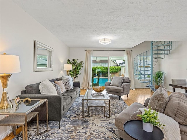 1234 N Pass Ave, Burbank, CA 91505 - living area with a textured ceiling, wood finished floors, and stairway