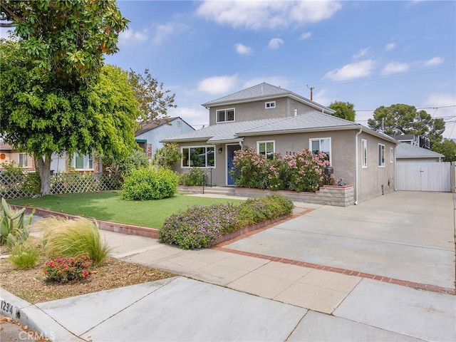 1234 N Pass Ave, Burbank, CA 91505 - traditional-style house with driveway, a front yard, a gate, fence, and stucco siding