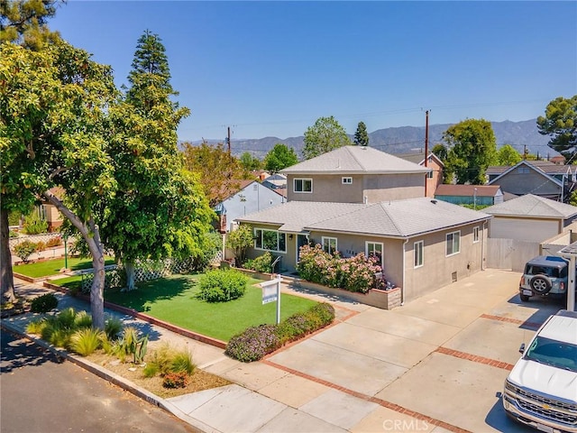 1234 N Pass Ave, Burbank, CA 91505 - view of front facade featuring roof with shingles, a front yard, fence, a mountain view, and stucco siding