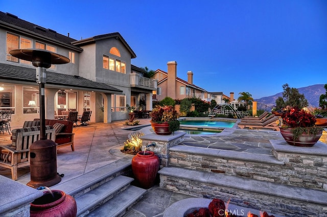26930 Ironstone, Yorba Linda, CA 92887 - view of patio featuring a balcony, a mountain view, and a pool with connected hot tub