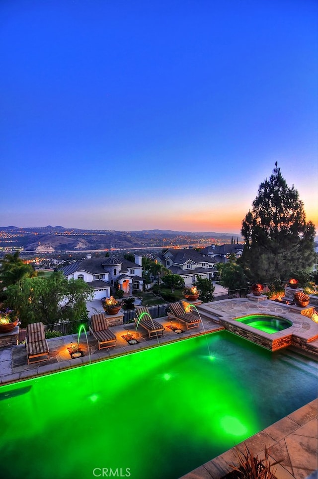 26930 Ironstone, Yorba Linda, CA 92887 - pool at dusk with an in-ground hot tub and an area to practice putting