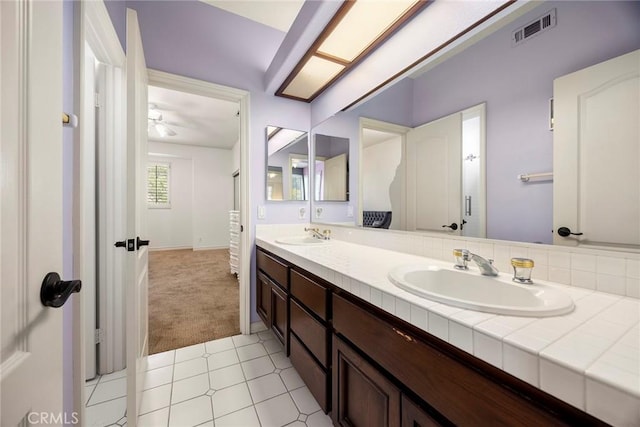 26930 Ironstone, Yorba Linda, CA 92887 - bathroom with double vanity, a ceiling fan, and baseboards