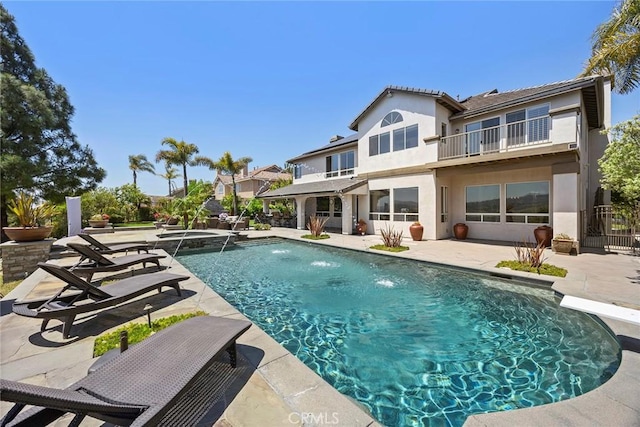 26930 Ironstone, Yorba Linda, CA 92887 - rear view of property with a balcony, stucco siding, a patio area, and a pool with connected hot tub