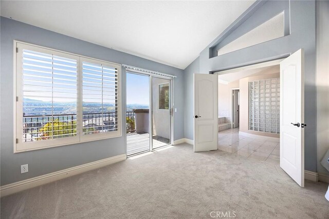 26930 Ironstone, Yorba Linda, CA 92887 - unfurnished bedroom with carpet, lofted ceiling, access to outside, and baseboards