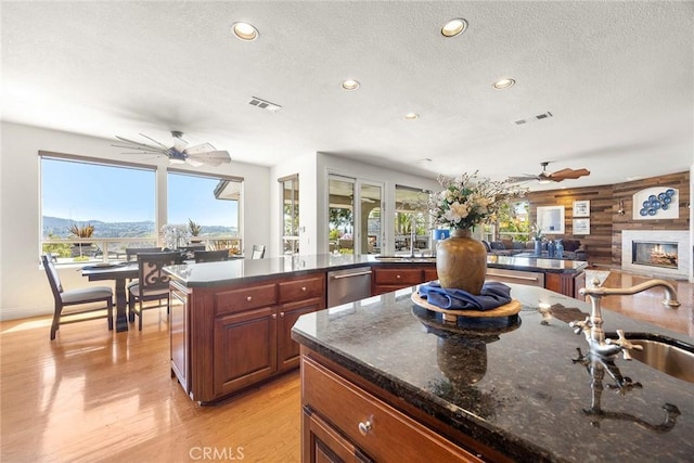 26930 Ironstone, Yorba Linda, CA 92887 - kitchen featuring ceiling fan, a textured ceiling, recessed lighting, light wood-style flooring, and stainless steel dishwasher