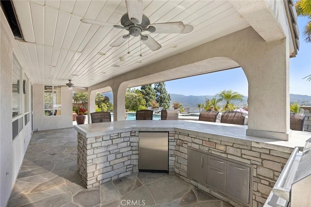 26930 Ironstone, Yorba Linda, CA 92887 - view of patio featuring a mountain view, exterior kitchen, and a ceiling fan