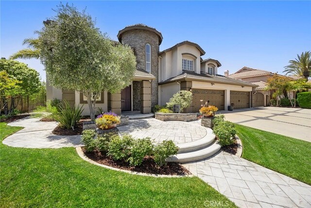 26930 Ironstone, Yorba Linda, CA 92887 - view of front of house with stucco siding, stone siding, driveway, and a garage