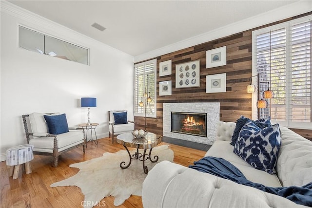 26930 Ironstone, Yorba Linda, CA 92887 - living area with ornamental molding, wooden walls, a fireplace, baseboards, and wood finished floors