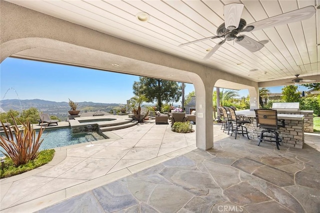 26930 Ironstone, Yorba Linda, CA 92887 - view of patio featuring a ceiling fan, a mountain view, and a pool with connected hot tub