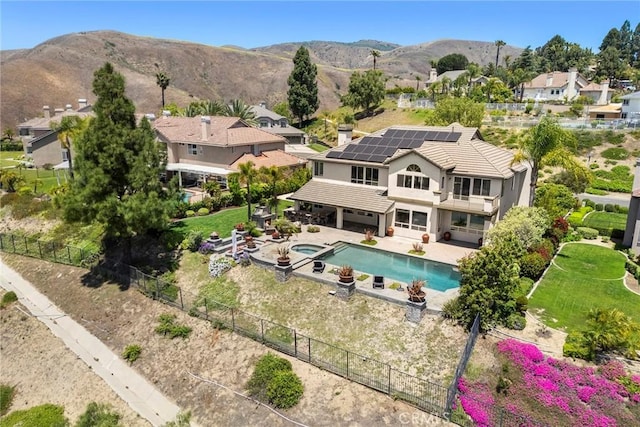 26930 Ironstone, Yorba Linda, CA 92887 - view of swimming pool featuring a fenced backyard, a pool with connected hot tub, a patio, a residential view, and a mountain view