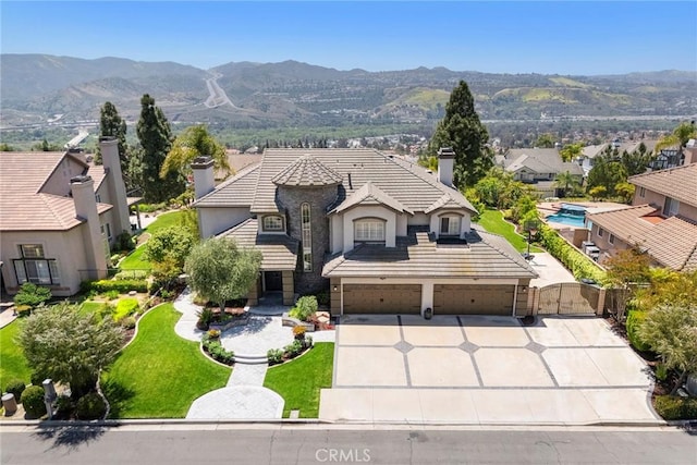 26930 Ironstone, Yorba Linda, CA 92887 - french country inspired facade featuring a chimney, a gate, concrete driveway, stucco siding, and a tiled roof