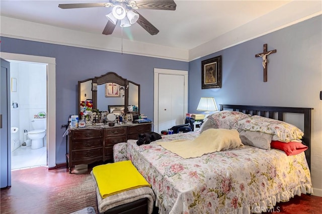 bedroom featuring baseboards, ceiling fan, and connected bathroom