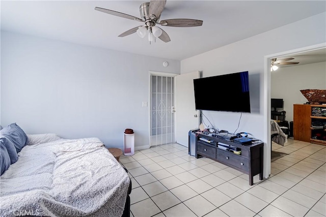 bedroom featuring a ceiling fan and light tile patterned floors