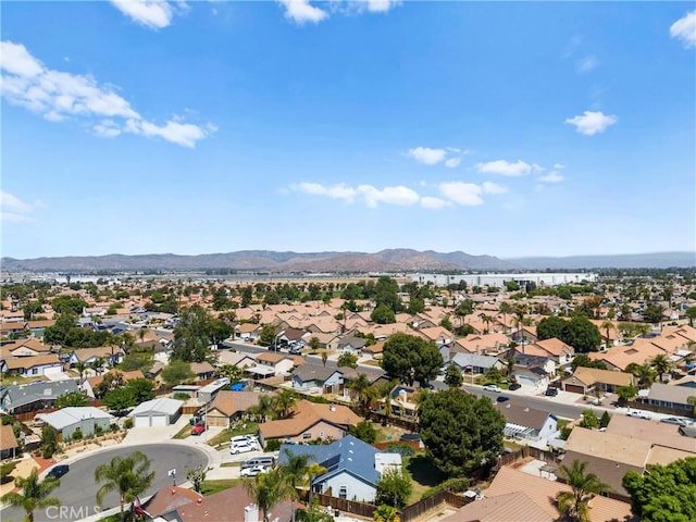 aerial perspective of suburban area featuring a mountain backdrop