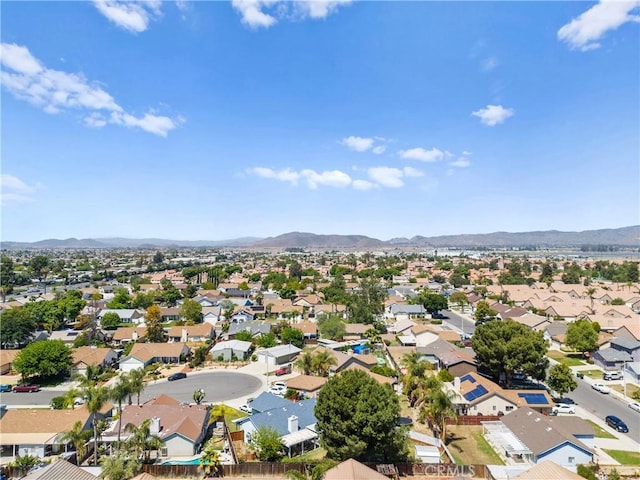 aerial view of residential area with mountains