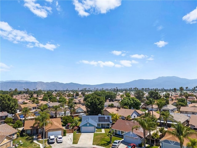 aerial view of residential area with a mountainous background