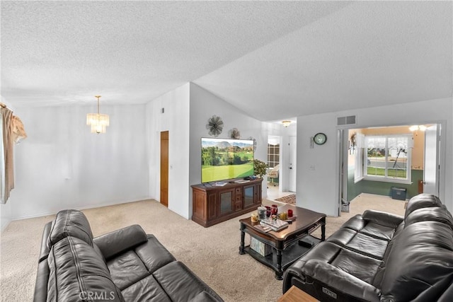 living area with carpet floors, a chandelier, a textured ceiling, and lofted ceiling