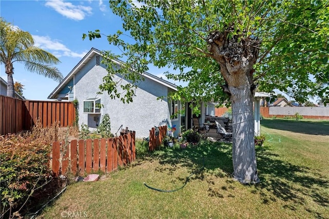 view of side of property featuring stucco siding