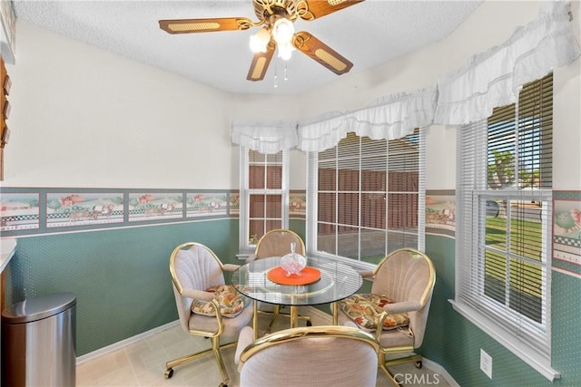 dining area with a ceiling fan