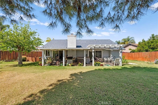 rear view of property with a pergola, stucco siding, a patio, and a chimney
