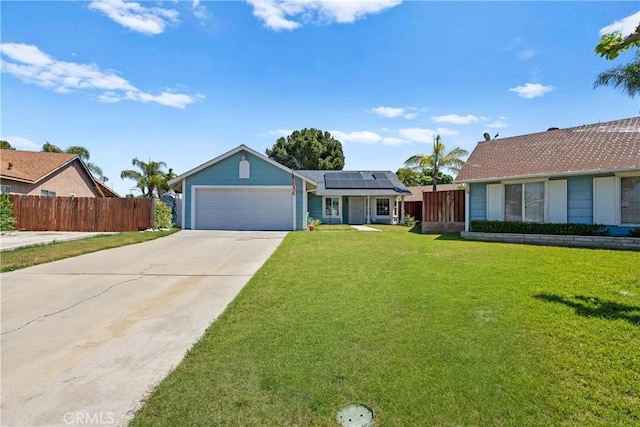view of front facade featuring solar panels, concrete driveway, and an attached garage