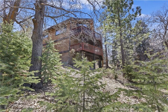 view of property exterior with a deck