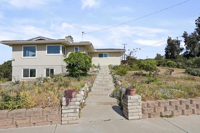 5884 Redondo Dr, Bonsall, CA 92003 - view of front facade featuring stairway and a chimney