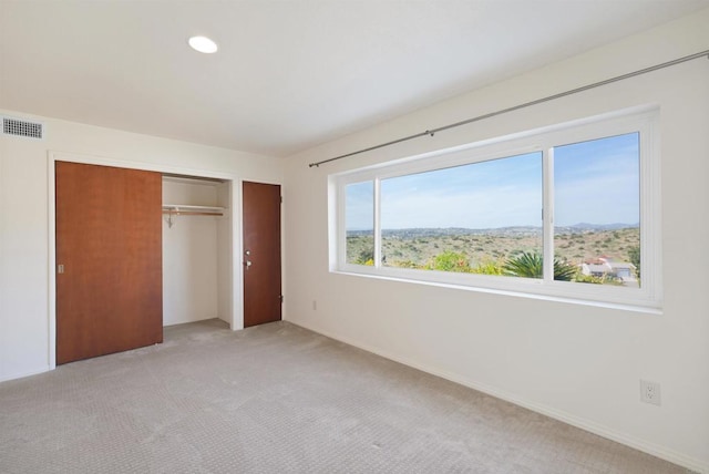 5884 Redondo Dr, Bonsall, CA 92003 - unfurnished bedroom featuring light colored carpet, a closet, baseboards, and recessed lighting