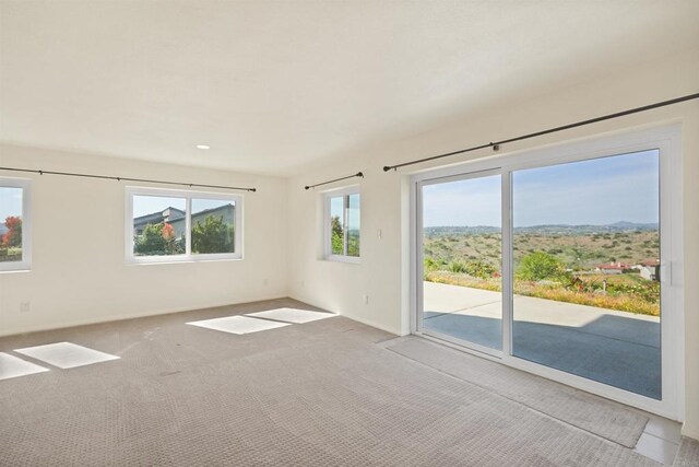 5884 Redondo Dr, Bonsall, CA 92003 - unfurnished room featuring healthy amount of natural light, carpet floors, baseboards, and recessed lighting