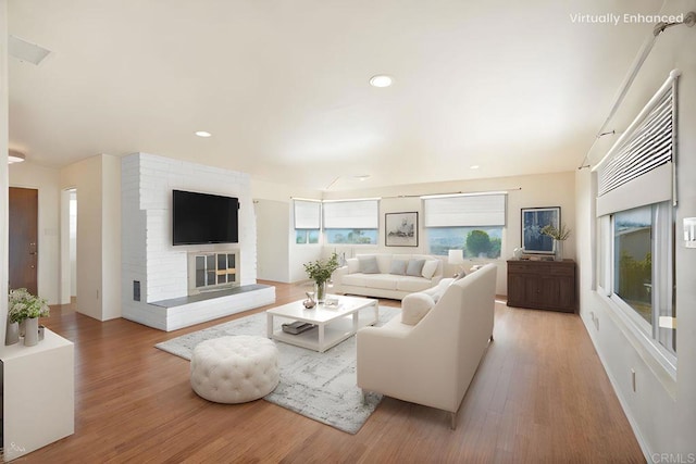 5884 Redondo Dr, Bonsall, CA 92003 - living area with light wood-style floors, a brick fireplace, and recessed lighting
