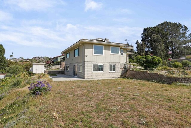 5884 Redondo Dr, Bonsall, CA 92003 - back of property featuring a patio and a lawn