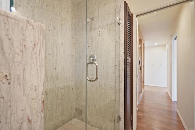 5884 Redondo Dr, Bonsall, CA 92003 - bathroom with a shower stall, wood finished floors, and baseboards