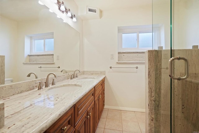 5884 Redondo Dr, Bonsall, CA 92003 - full bath featuring healthy amount of natural light, double vanity, a shower stall, and tile patterned floors
