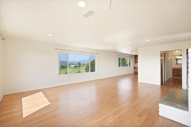 5884 Redondo Dr, Bonsall, CA 92003 - unfurnished living room featuring recessed lighting and light wood-style flooring