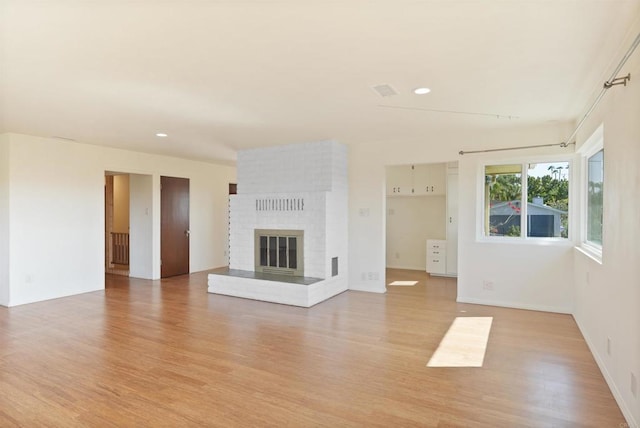 5884 Redondo Dr, Bonsall, CA 92003 - unfurnished living room with light wood-type flooring, recessed lighting, a fireplace, and baseboards