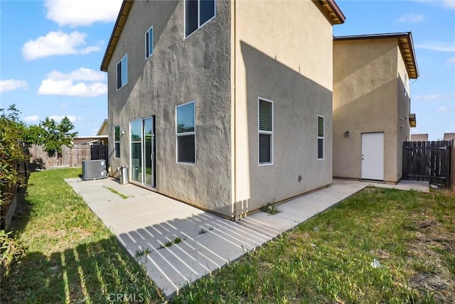 rear view of property with a patio, a fenced backyard, and stucco siding