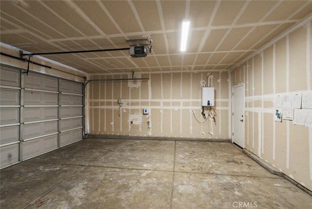 garage featuring a garage door opener and tankless water heater