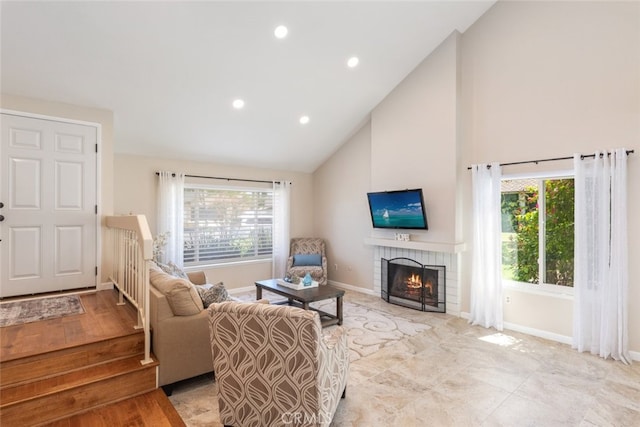 1452 Granada, Corona, CA 92878 - living room with high vaulted ceiling, a brick fireplace, baseboards, and recessed lighting