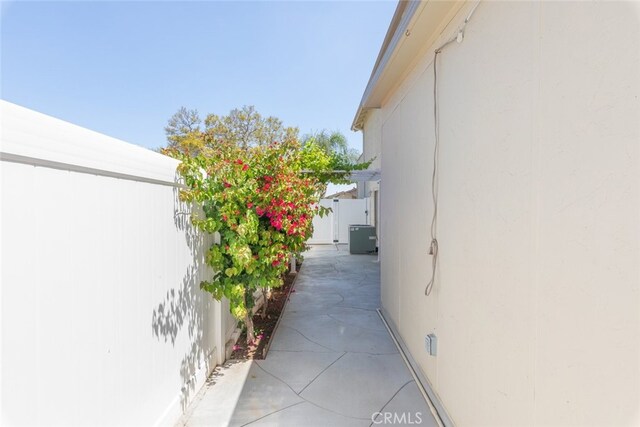 1452 Granada, Corona, CA 92878 - view of side of property featuring a gate, stucco siding, and fence