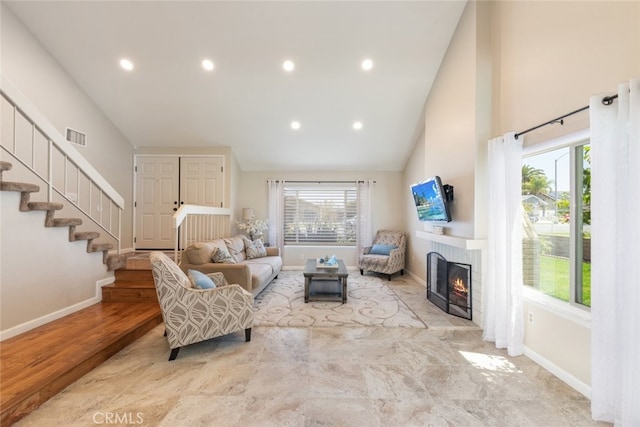 1452 Granada, Corona, CA 92878 - living room featuring a brick fireplace, baseboards, stairs, high vaulted ceiling, and recessed lighting