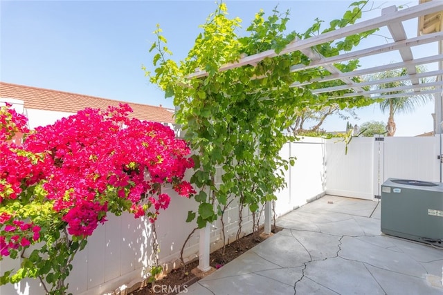 1452 Granada, Corona, CA 92878 - view of patio / terrace with fence and central AC