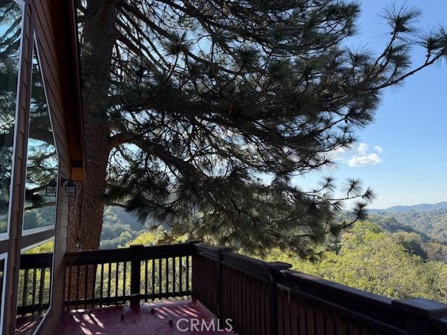 373 Davos Dr, Crestline, CA 92325 - wooden deck with a mountain view