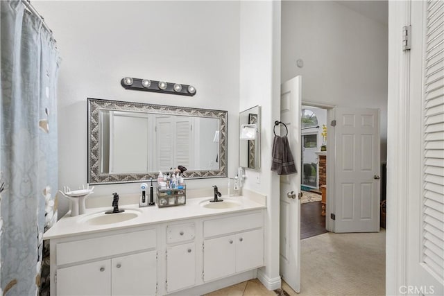 42065 Kaffirboom Ct, Temecula, CA 92591 - full bathroom featuring double vanity and a towering ceiling