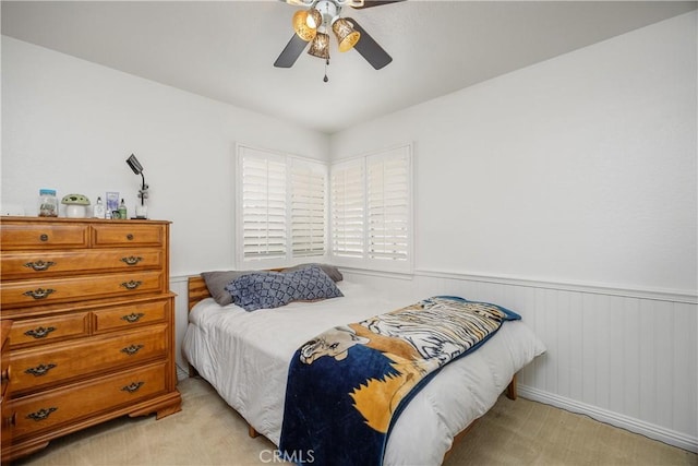 42065 Kaffirboom Ct, Temecula, CA 92591 - bedroom featuring wainscoting, light carpet, and a ceiling fan