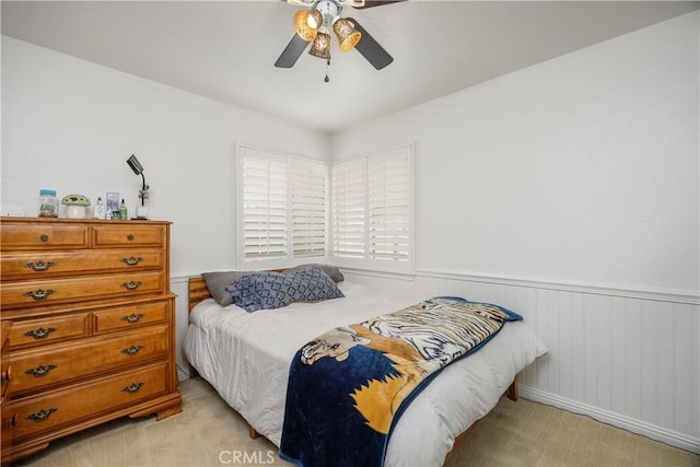 42065 Kaffirboom Ct, Temecula, CA 92591 - bedroom with a wainscoted wall, light colored carpet, and a ceiling fan
