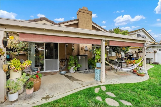 42065 Kaffirboom Ct, Temecula, CA 92591 - rear view of property featuring a patio area, a tile roof, and a chimney